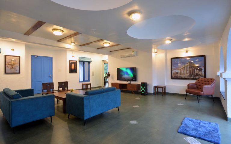 3BHK Villa drawing room: Ample space with a large TV for viewing.