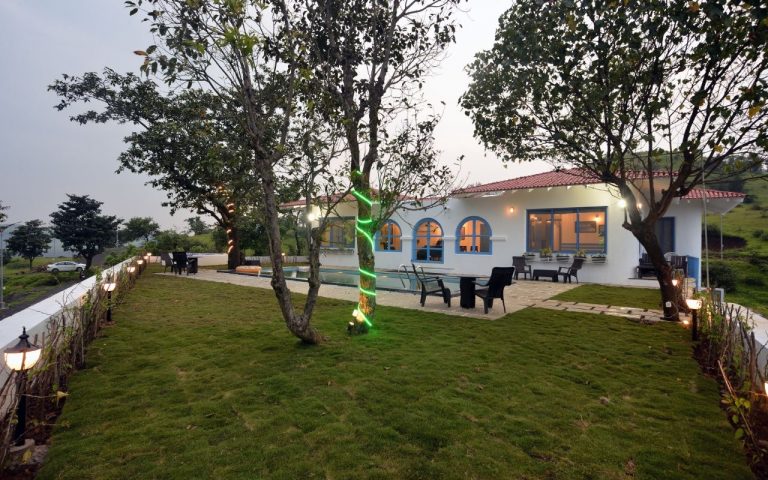 Lawn sitting area in 3BHK villa: Perfect for outdoor relaxation.