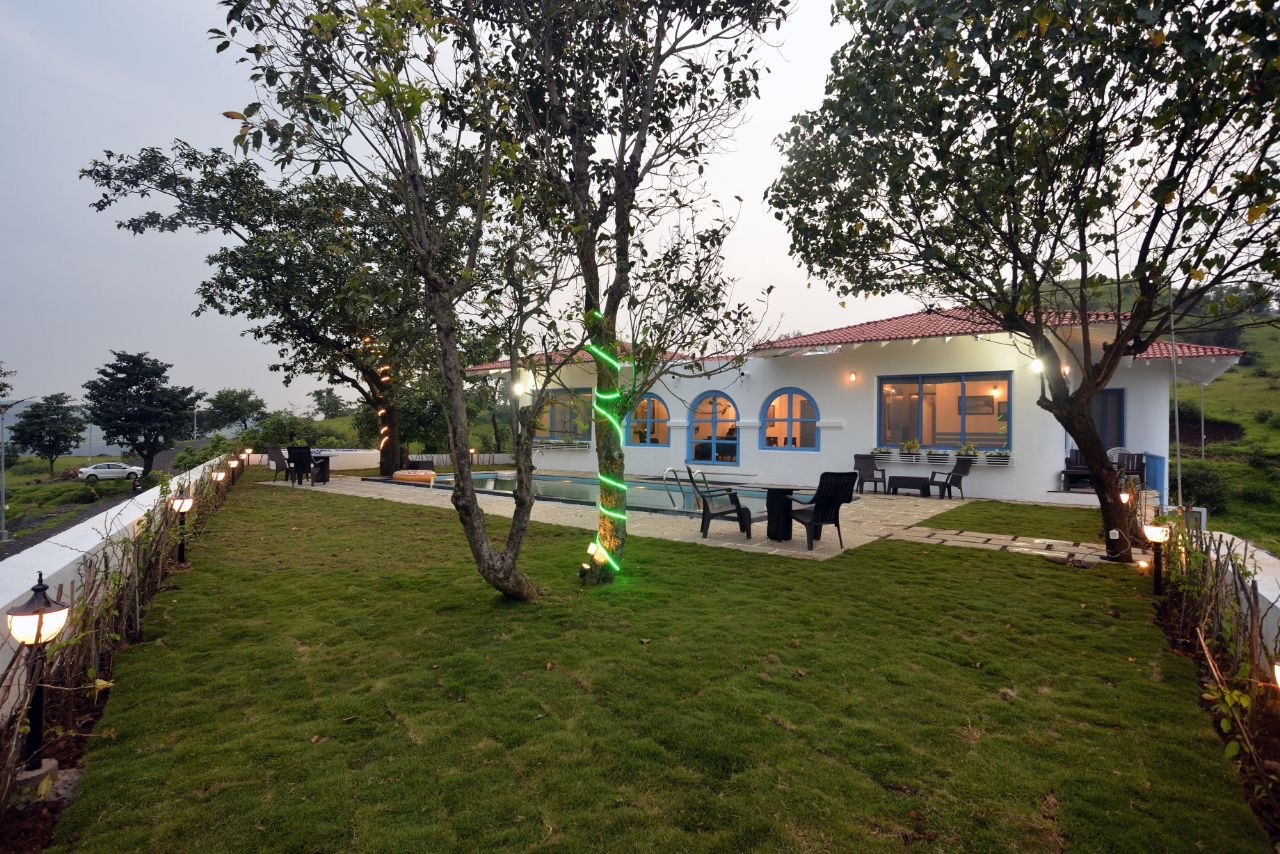 Lawn sitting area in 3BHK villa: Perfect for outdoor relaxation.