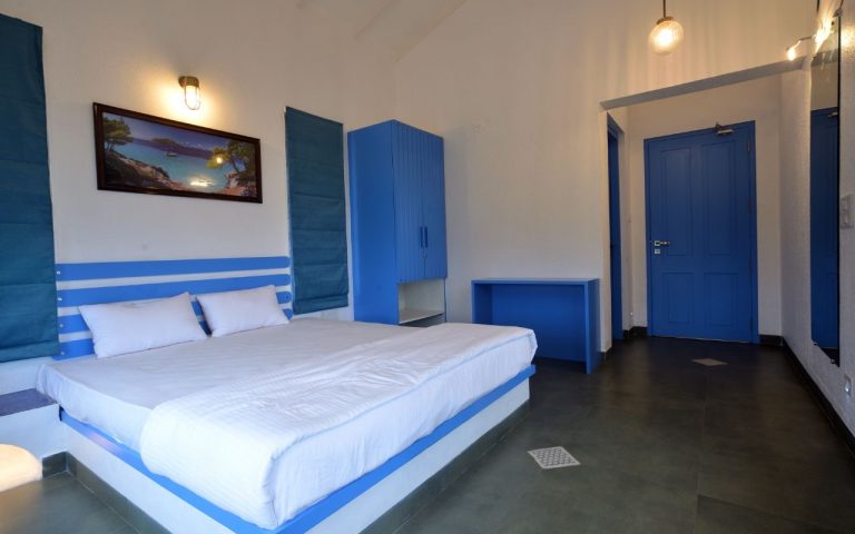 Comfortable bedroom 1 in the 3BHK villa.