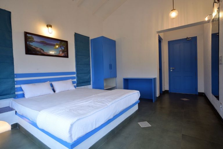 Comfortable bedroom 1 in the 3BHK villa.