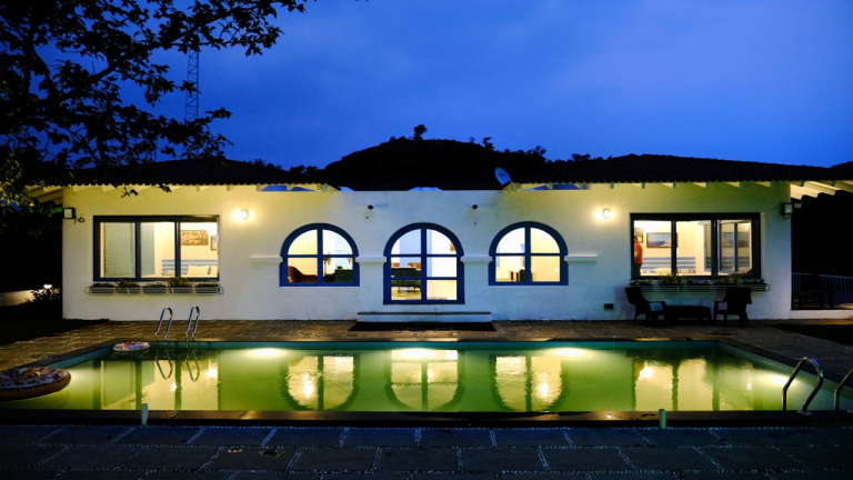 3BHK Villa pool at night: A calm and inviting scene.