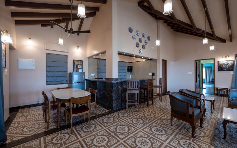 he kitchen of a 4bhk Alang cottage villa, showcasing modern appliances.