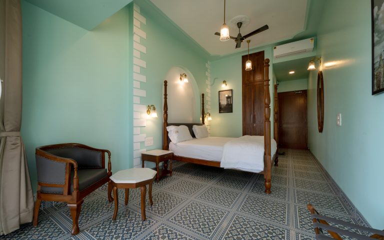 Bedroom 2 of a 4bhk Alang cottage villa, showcasing cozy furnishings, soft lighting, and a welcoming ambiance for relaxation and comfort.