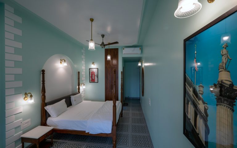 Bedroom 3 of a 4bhk Alang cottage villa, showcasing cozy furnishings, soft lighting, and a tranquil ambiance, perfect for rest and relaxation.