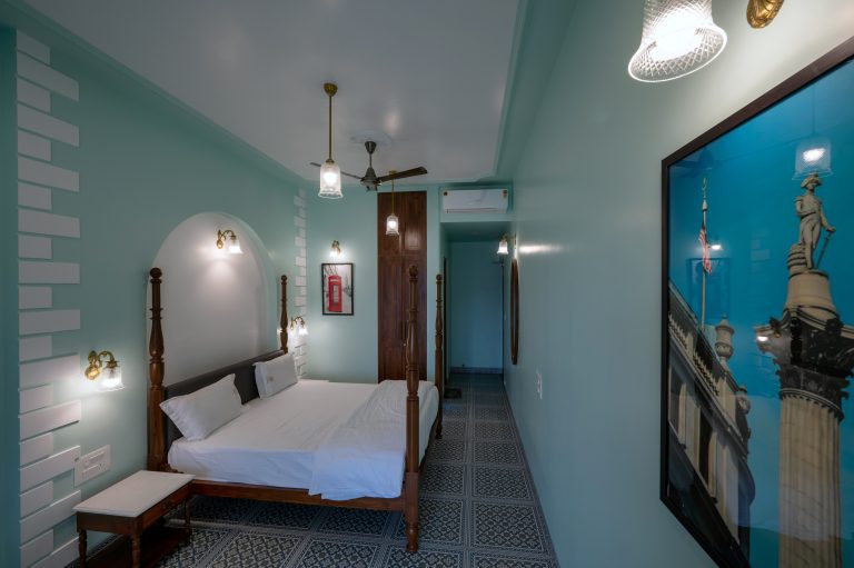 Bedroom 3 of a 4bhk Alang cottage villa, showcasing cozy furnishings, soft lighting, and a tranquil ambiance, perfect for rest and relaxation.