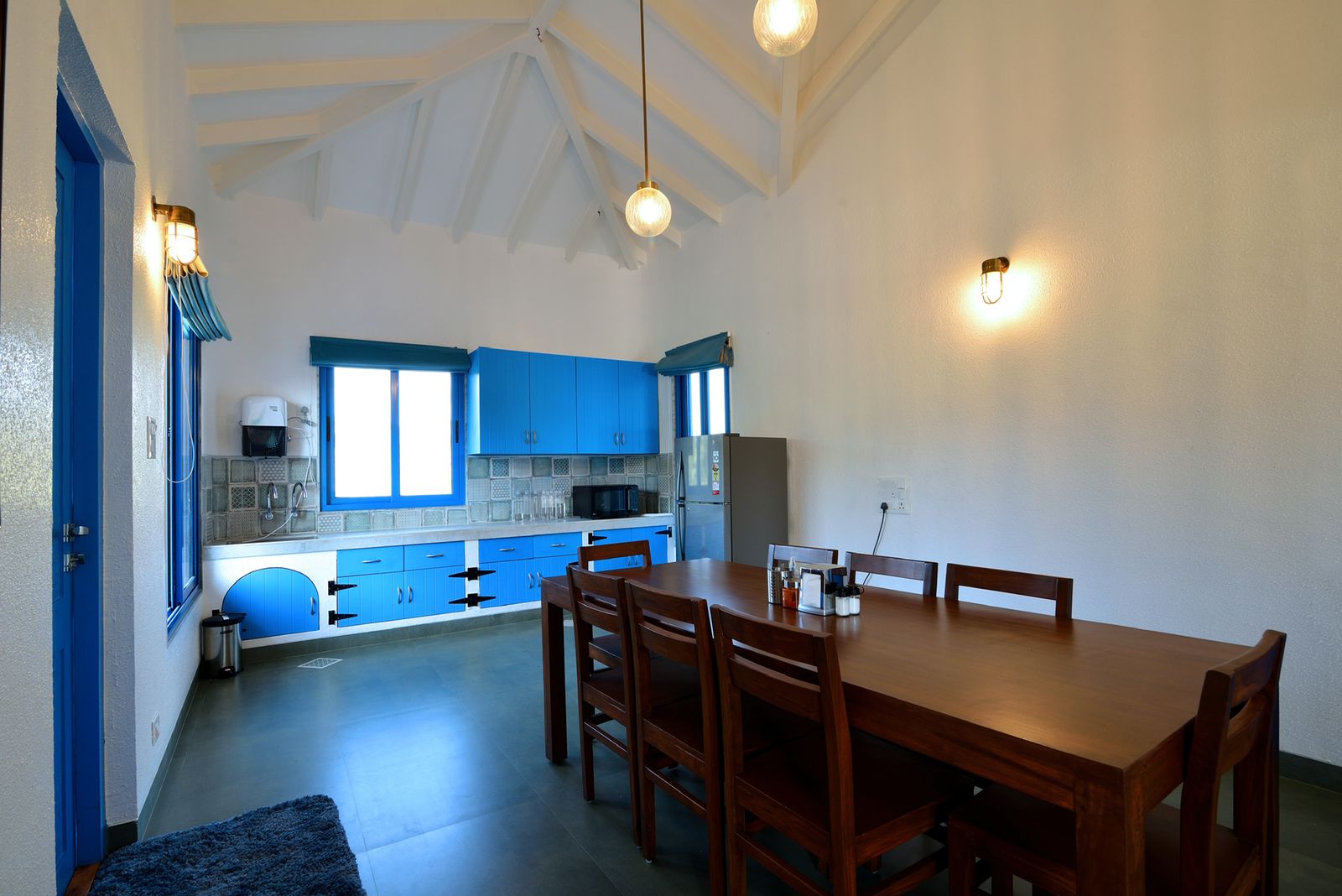 Bright kitchen in 3BHK villa : Ideal for cooking and gathering.